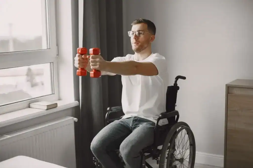 Image of man doing exercise in his wheelchair to aid weight loss Sunbury-on-Thames