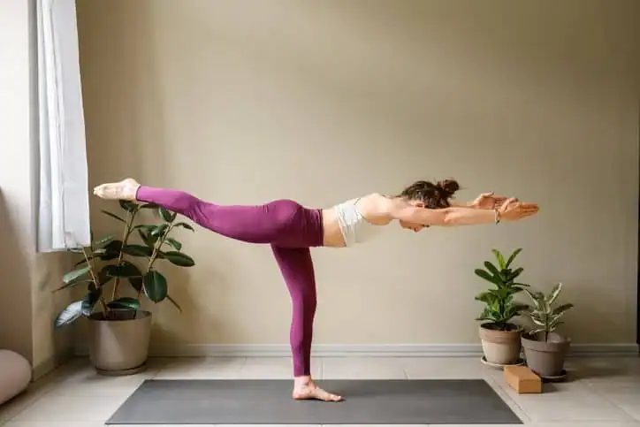 Achieving the Perfect Tone: How Often Should You Exercise for Results? 1 Woman doing Yoga exercise Sunbury-on-Thames to help with toning the body.