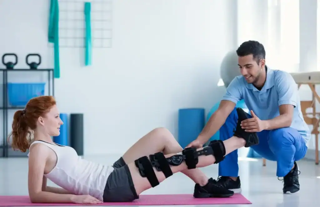 Woman having treatment to help muscle recovery Sunbury-on-Thames after an injury