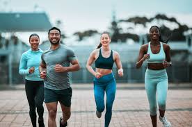 image of people running to incorporate cardio Sunbury-on-Thames exercise into their life to help tone arms and body.
