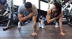 Image of man and woman doing Cardio Sunbury-on-Thames to tone their arms. 